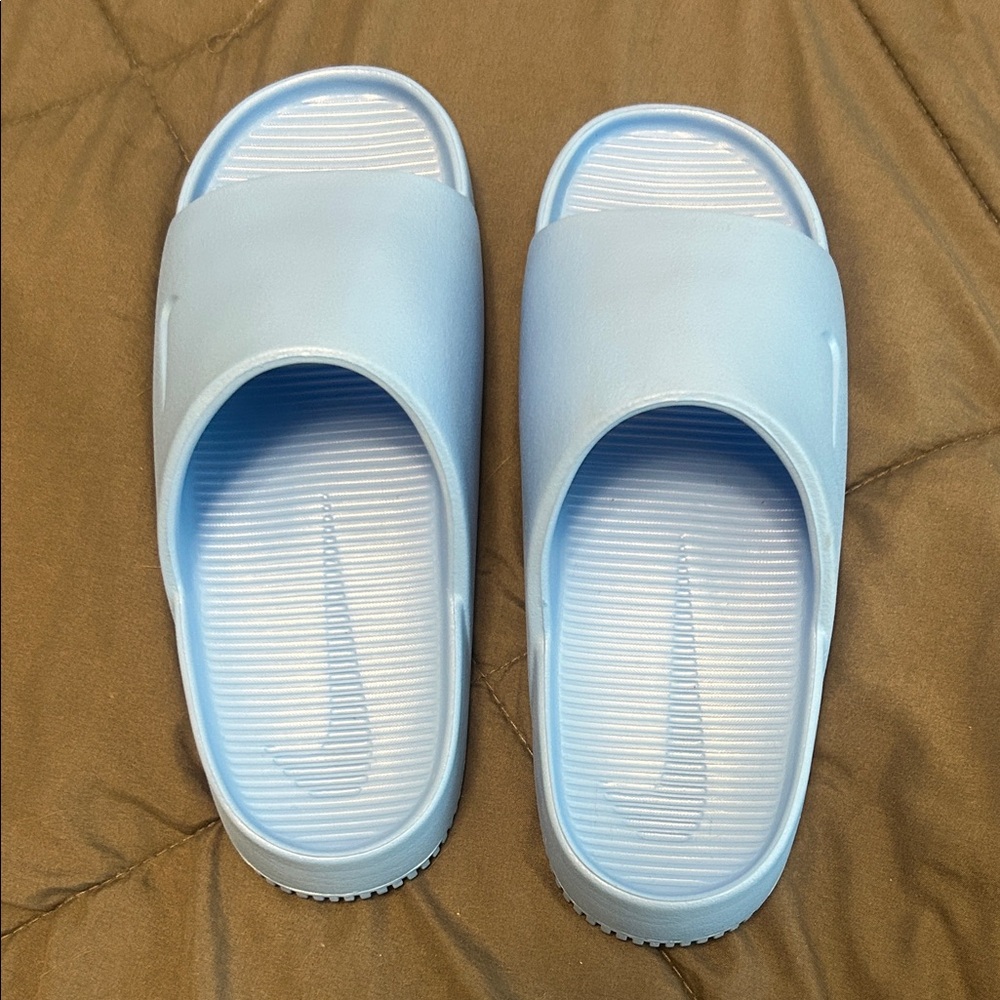 Nike Light Blue Slide Sandals.